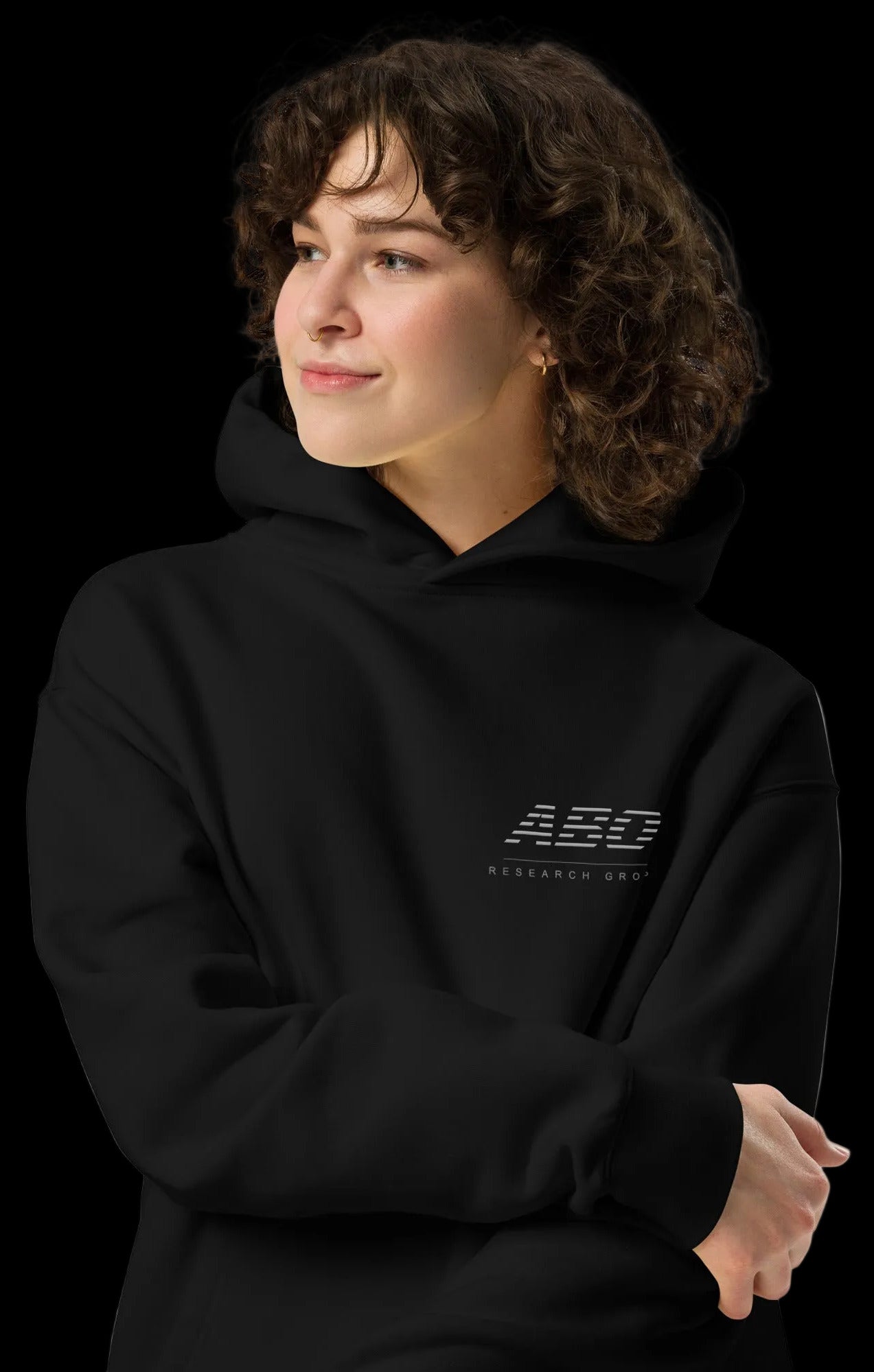 Person wearing a black hoodie with a logo on a white background
