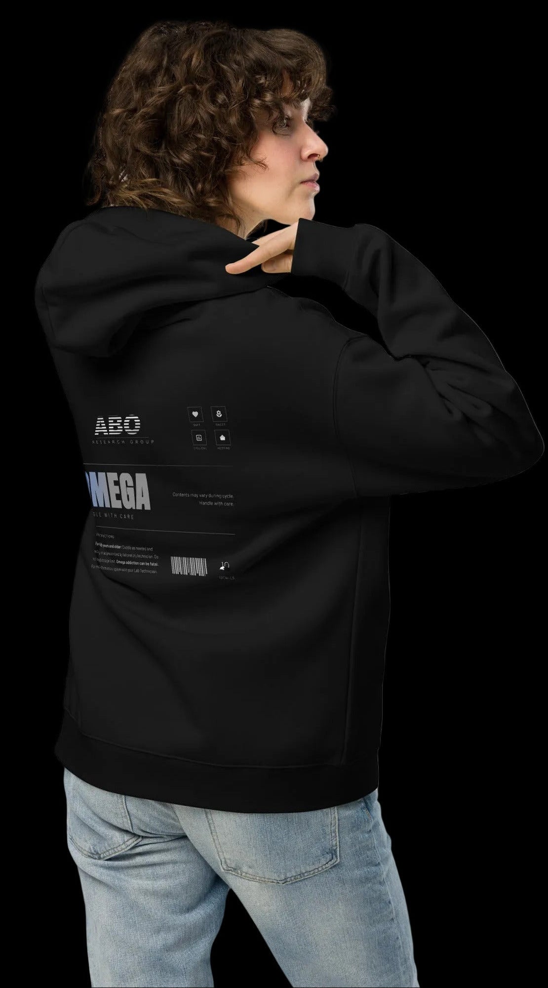 Person wearing a black hoodie with text on the back against a white background
